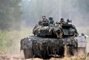Soldiers of the NATO enhanced forward presence battalion in a German Leopard 2 tank take part in NATO military exercises at the Rukla military base, west of Vilnius, Lithuania, Aug. 11, 2017 (AP photo by Mindaugas Kulbis).