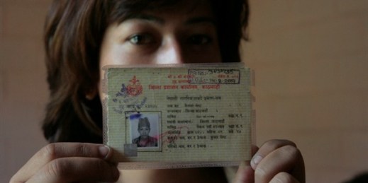 A Nepali transgender activist shows her citizenship certificate, which lists her as male, barring her from obtaining other documents and accessing services and employment, Kathmandu, Nepal, June 2011 (IRIN photo by Kyle Knight).
