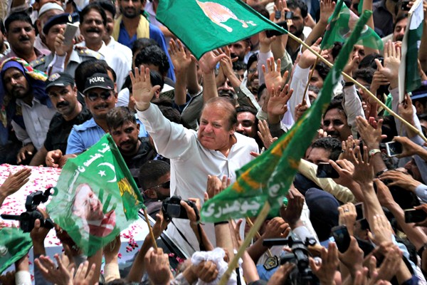 Former Pakistani Prime Minister Nawaz Sharif waves to supporters gathered on a highway outside Islamabad, Aug. 5, 2017 (AP photo by Anjum Naveed).