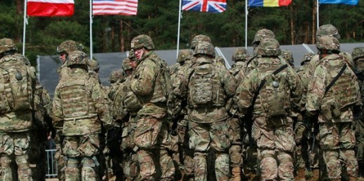 U.S. troops, part of a NATO mission to enhance Poland’s defense, prepare for an official welcoming ceremony, Orzysz, Poland, April 13, 2017 (AP photo by Czarek Sokolowski).