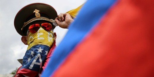 An anti-government demonstrator wearing a Russian military hat protests the government of Venezuelan President Nicolas Maduro in Caracas, Venezuela, Aug. 6, 2017 (AP photo by Wil Riera).