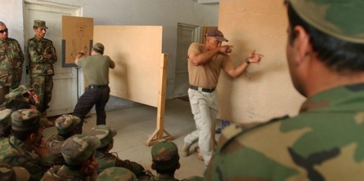 Contractors from the U.S. security firm Blackwater give instructions to Afghan anti-narcotics forces in Kabul, Afghanistan, May 15, 2005 (AP photo by Musadeq Sadeq).