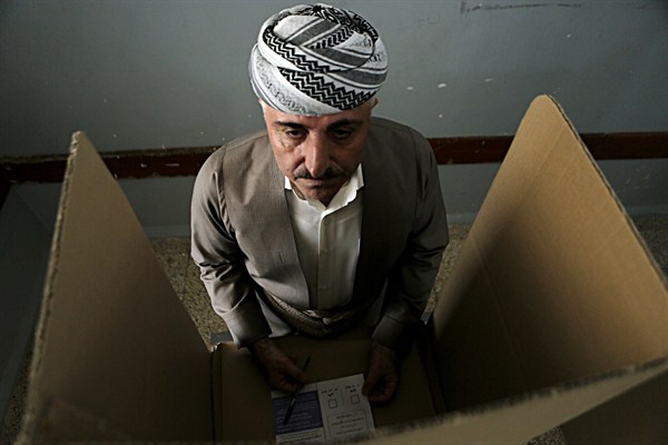 An Iraqi Kurdish man prepares to cast his ballot during the referendum on independence from Iraq, Irbil, Iraq, Sept. 25, 2017 (AP photo by Khalid Mohammed).
