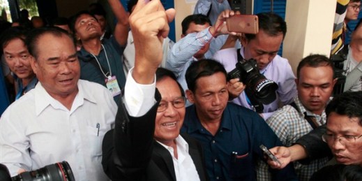 Kem Sokha, a Cambodian opposition leader who was arrested earlier this month, shows his inked finger after voting in local elections on the outskirts of Phnom Penh, Cambodia, June 4, 2017 (AP photo by Heng Sinith).