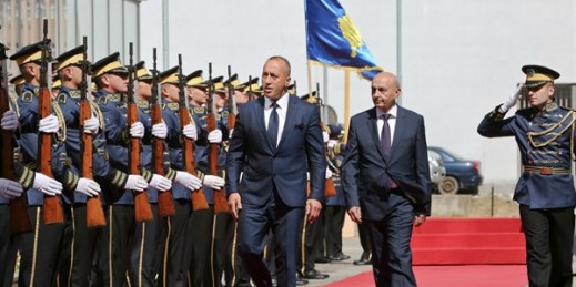 Kosovo’s newly elected prime minister, Ramush Haradinaj, left, and outgoing prime minister, Isa Mustafa, during a handover ceremony, Pristina, Kosovo, Sept. 11, 2017 (AP photo by Visar Kryeziu).
