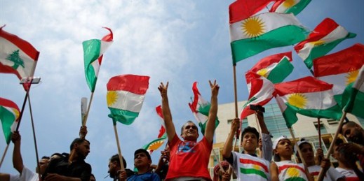 Kurds wave Kurdish flags and flash the victory sign as they gather to support the referendum in Iraq, Beirut, Lebanon, Sept. 17, 2017 (AP photo by Hassan Ammar).