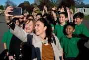 New Zealand Labour Party leader Jacinda Ardern takes a selfie with school children during a visit to Addington School, Christchurch, New Zealand, Aug. 16, 2017 (AP photo by Mark Baker).