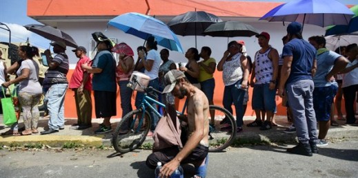 People affected by Hurricane Maria wait in line to receive supplies from the National Guard, San Juan, Puerto Rico, Sept. 24, 2017 (AP photo by Carlos Giusti).