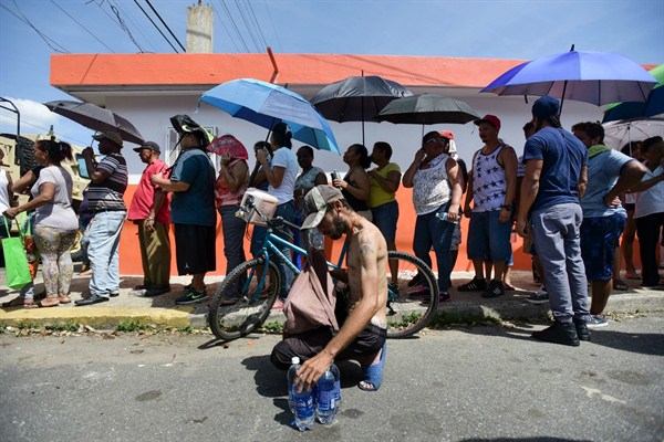People affected by Hurricane Maria wait in line to receive supplies from the National Guard, San Juan, Puerto Rico, Sept. 24, 2017 (AP photo by Carlos Giusti).
