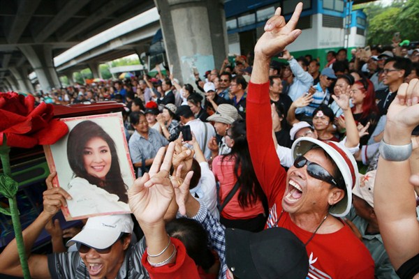 Supporters of Thailand’s former prime minister, Yingluck Shinawatra, outside the Supreme Court after she failed to show up for a verdict, Bangkok, Thailand, Aug. 25, 2017 (AP photo by Wason Wanichakorn).