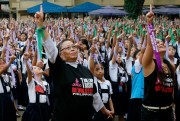Female protesters flash the No. 1 sign as part of the “One Billion Rising” global movement to end violence against women and children, Manila, Philippines, Feb. 15, 2016 (AP photo by Bullit Marquez).
