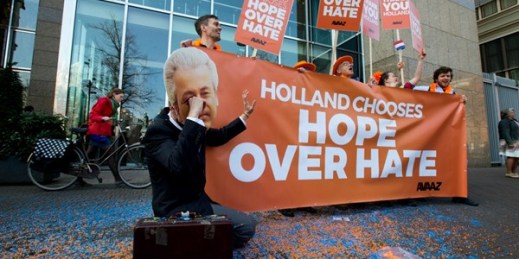 A man poses as a crying Geert Wilders, the firebrand anti-Islam lawmaker, during a small demonstration outside parliament in The Hague, Netherlands, March 16, 2017 (AP photo by Peter Dejong).