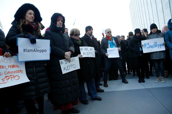 United Nations staff and other demonstrators assemble at U.N. headquarters to show their solidarity with the people of Aleppo, New York, Dec. 15, 2016 (AP photo by Seth Wenig).