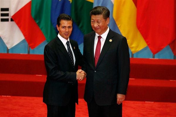 Mexican President Enrique Pena Nieto poses with Chinese President Xi Jinping at the G20 Summit, Hangzhou, China, Sept. 4, 2016 (AP photo by Ng Han Guan).