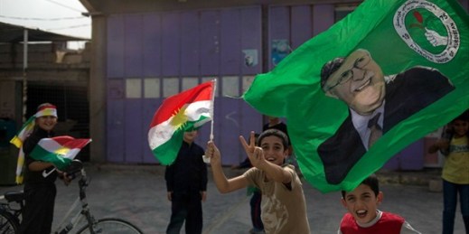 Children holding Kurdish flags run on the streets of Kirkuk, Iraq, Sept. 25, 2017 (AP photo by Bram Janssen).