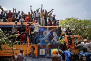 Opposition protesters ride on a truck bearing pictures of Kenyan opposition leaders Raila Odinga and Kalonzo Musyoka, Nairobi, Kenya, Sept. 26, 2017 (AP photo by Ben Curtis).