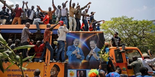 Opposition protesters ride on a truck bearing pictures of Kenyan opposition leaders Raila Odinga and Kalonzo Musyoka, Nairobi, Kenya, Sept. 26, 2017 (AP photo by Ben Curtis).