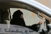 Aziza Yousef drives a car on a highway as part of a campaign to defy Saudi Arabia’s ban on women driving, Riyadh, Saudi Arabia, March 29, 2014 (AP photo by Hasam Jamali).