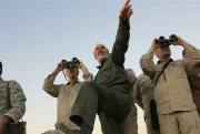 Iran’s army chief of staff, Maj. Gen. Mohammad Bagheri, left, looks into binoculars as he visits other senior officers from the Iranian military in the Syrian province of Aleppo, Oct. 20, 2017 (Syrian Central Military Media via AP).