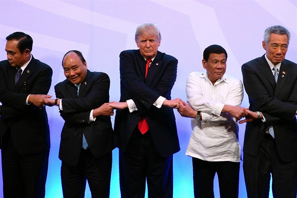 Singapore Prime Minister Lee Hsien Loong, right, poses with U.S. President Donald Trump and other leaders during the ASEAN-U.S. Summit, Manila, Philippines, Nov. 13, 2017 (Photo by Manan Vatsyayana via AP).