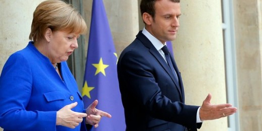French President Emmanuel Macron greets German Chancellor Angela Merkel prior to a joint Franco-German cabinet meeting at the Elysee Palace in Paris, July 12, 2017 (AP photo by Michel Euler).
