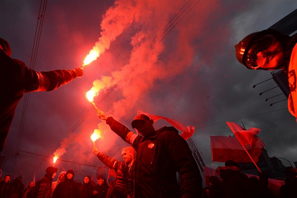 Nationalists burn flares during a march to mark Poland’s Independence Day, Warsaw, Nov. 11, 2017 (AP photo by Czarek Sokolowski). The march suggests Poland is at risk of becoming the European capital of xenophobia.