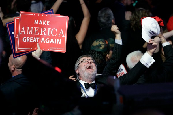 Supporters of Republican presidential candidate Donald Trump react as they watch the election results during Trump's election night rally in New York, Nov. 8, 2016 (AP photo by John Locher).