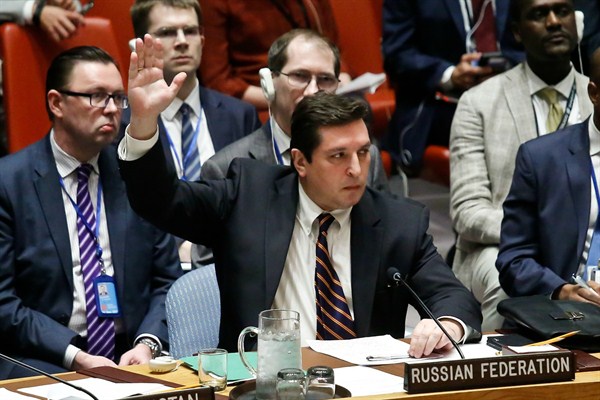 Russian Deputy U.N. Ambassador Vladimir Safronkov raises his hand to vote against a resolution condemning Syria’s use of chemical weapons, U.N. headquarters, New York, April 12, 2017 (AP photo by Bebeto Matthews).
