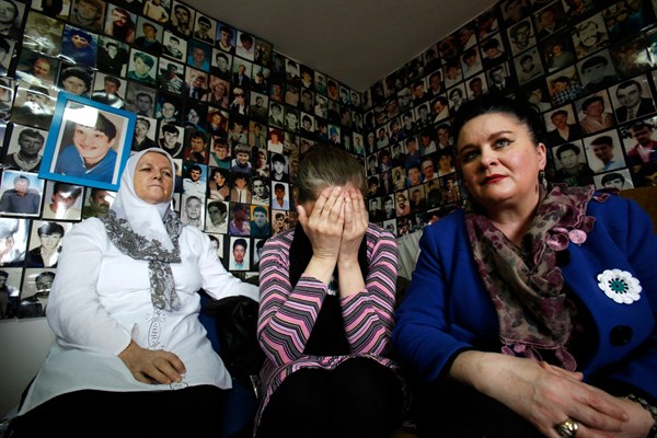 Women who lost family members at Srebrenica react as they watch a TV broadcast of the sentencing of Radovan Karadzic at the International Criminal Tribunal for the Former Yugoslavia, Tuzla, Bosnia, March 24, 2016 (AP photo by Amel Emric).