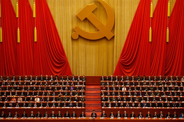 Chinese President Xi Jinping, front row center, applauds during the closing ceremony of the 19th Party Congress, Beijing, Oct. 24, 2017 (AP photo by Andy Wong).