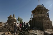 Iraqis from the Yazidi community rebuild temples destroyed by Islamic State fighters, Bashiqa, Iraq, Oct. 18, 2017 (AP photo Khalid Mohammed).