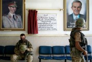 A Russian military policeman, left, rests in the lobby of a hospital in the city of Deir el-Zour, Syria, Sept. 15, 2017 (AP photo).