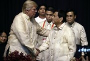 U.S. President Donald Trump shakes hands with Philippine President Rodrigo Duterte at an ASEAN summit dinner at the SMX Convention Center, Nov. 12, 2017 (AP photo by Andrew Harnik).