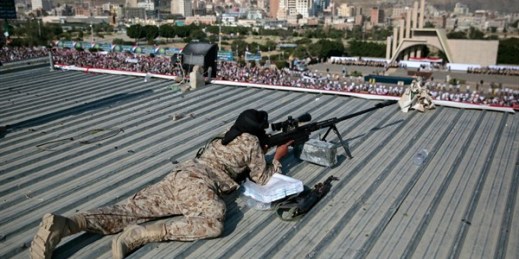 A Houthi sniper keeps watch over a rally to mark the third anniversary of the Houthis’ takeover of the Yemeni capital, Sanaa, Sept. 21, 2017 (AP photo by Hani Mohammed).