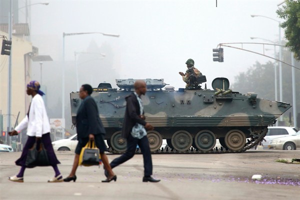 An armed soldier patrols a street in Harare, Zimbabwe, Nov. 15, 2017 (AP photo).