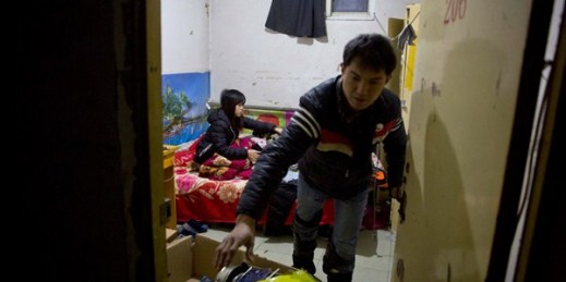A couple of migrant workers prepare to leave their apartment ahead of an eviction deadline in the outskirts of Beijing, China, Nov. 27, 2017 (AP photo by Ng Han Guan).