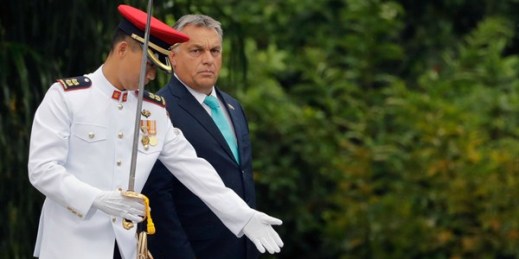 Hungarian Prime Minister Viktor Orban proceeds to inspect the honor guard during a welcome ceremony in Singapore, Sept. 26, 2017 (AP photo by Wong Maye-E).