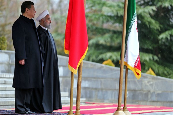 Chinese President Xi Jinping is welcomed by Iranian President Hassan Rouhani to the Saadabad Palace, Tehran, Iran, Jan. 23, 2016 (AP photo by Ebrahim Noroozi).