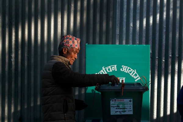 A Nepalese man casts his vote during the legislative elections in Chautara, Sindupalchowk, Nepal, Nov. 26, 2017 (AP photo by Niranjan Shrestha).