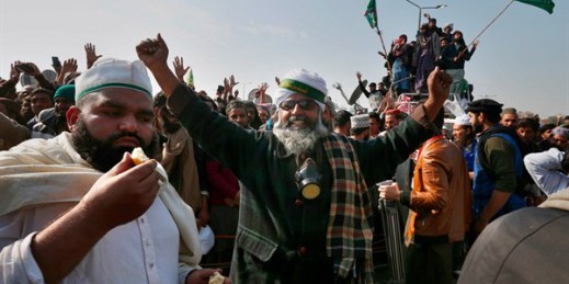 Supporters of Pakistan's Tehreek-i-Labaik Ya Rasool Allah party celebrate after Law Minister Zahid Hamid's resignation, Islamabad, Pakistan, Nov. 27, 2017 (AP photo by Anjum Naveed).