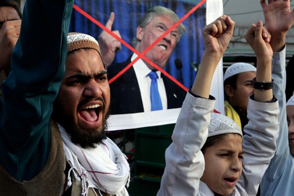 Pakistani religious students protest against U.S. President Donald Trump after the U.S. decision to suspend military aid to Islamabad, Lahore, Pakistan, Jan. 5, 2018 (AP photo by K.M. Chaudary).