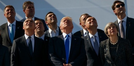 Donald Trump and other NATO leaders watch a flyover during a transfer ceremony at the new NATO headquarters, Brussels, May 25, 2017 (AP photo by Evan Vucci).