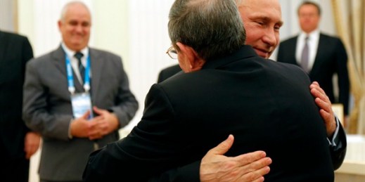 Russian President Vladimir Putin and Cuban President Raul Castro embrace during a meeting in Moscow, May 7, 2015 (Pool photo by Anatoly Maltsev via AP).
