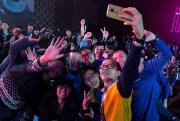 Attendees take a selfie before a press conference announcing the return of the Motorola brand to China, Beijing, Jan. 26, 2015 (AP photo by Ng Han Guan).