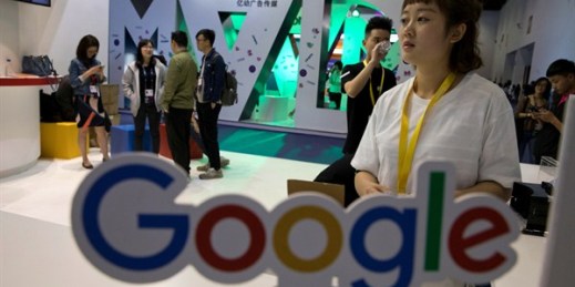 Visitors talk to staff members at a Google stand during the Global Mobile Internet Conference, Beijing, April 28, 2017 (AP photo by Ng Han Guan).