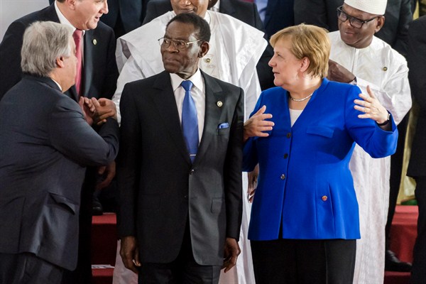 German Chancellor Angela Merkel speaks with Equatorial Guinea’s president, Teodoro Obiang Nguema Mbasogo, during an EU-Africa summit, Abidjan, Cote d’Ivoire, Nov. 29, 2017 (AP photo by Geert Vanden Wijngaert).