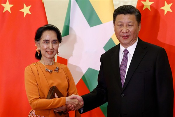 Myanmar leader Aung San Suu Kyi and Chinese President Xi Jinping pose for photographers at the Great Hall of the People, Beijing, May 16, 2017 (Pool photo by Damir Sagolj via AP).