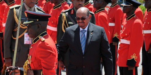 Sudanese President Omar al-Bashir inspects the honor guard after his arrival in Entebbe, Uganda, Nov. 13, 2017 (AP photo by Ronald Kabuubi).