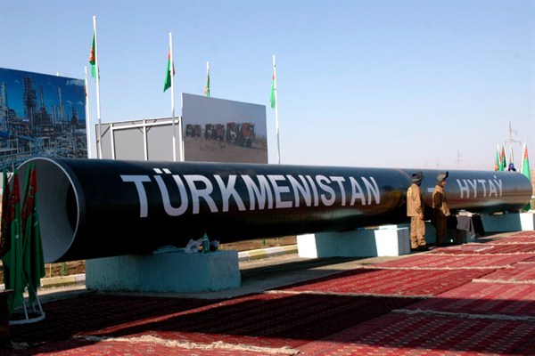 Symbolic pipes with a sign that reads "Turkmenistan—China" on exhibit at the Bagtyyarlyk natural gas field, Turkmenistan, Aug. 29, 2007 (AP photo by Alexander Vershinin).