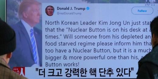 People watch a TV news program showing the Twitter post in which U.S. President Donald Trump boasted about the size of his  “nuclear button,” Seoul, South Korea, Jan. 3, 2018 (AP photo by Ahn Young-joon).